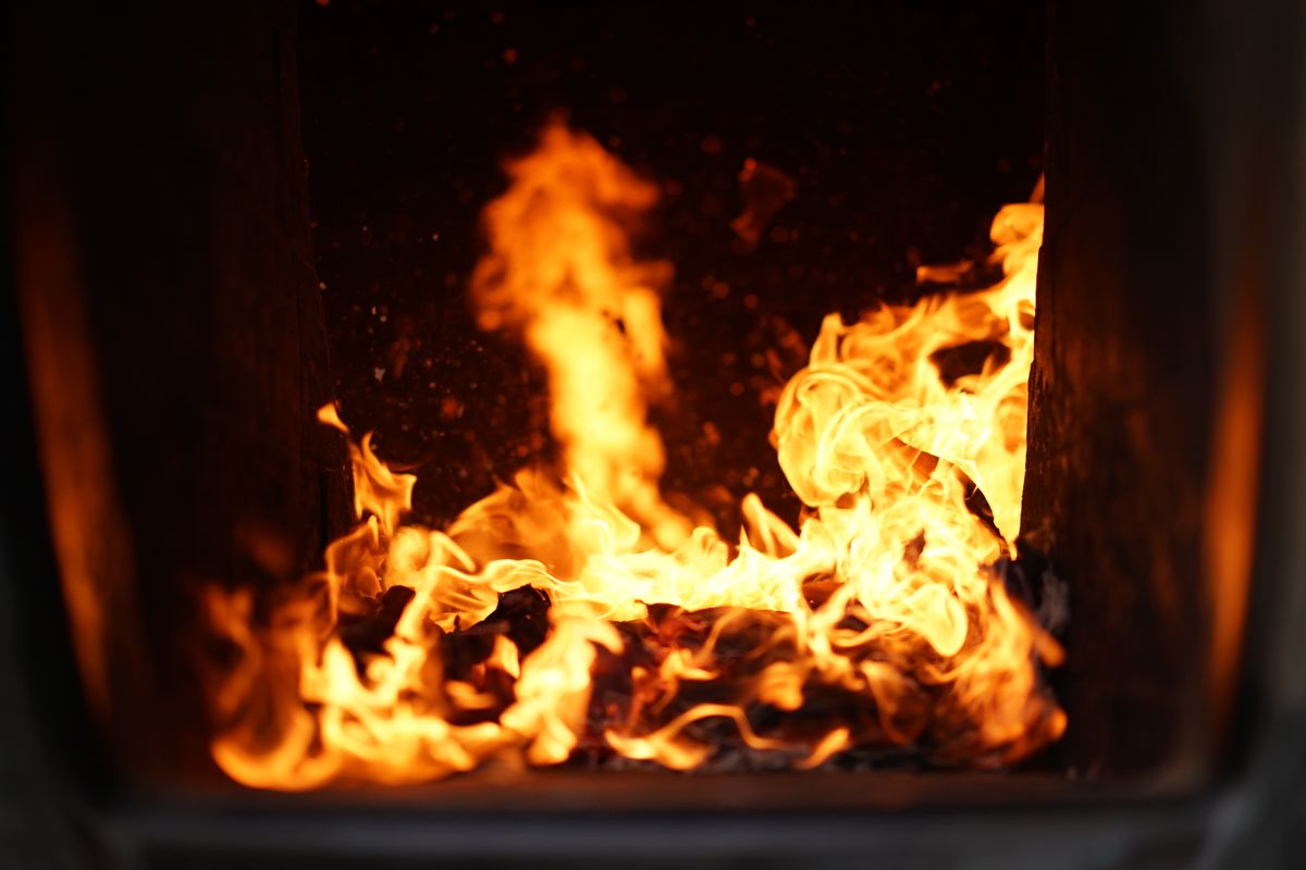 Technician servicing a residential gas furnace