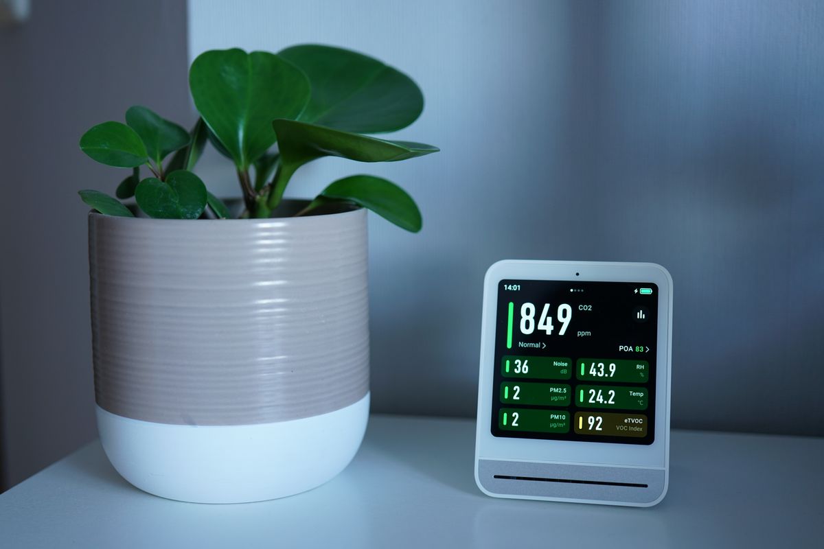 Indoor air quality monitor showing clean-air readings